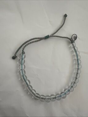 NWOT 4Ocean Adjustable Clear Bead Bracelet with Grey and Blue Cord